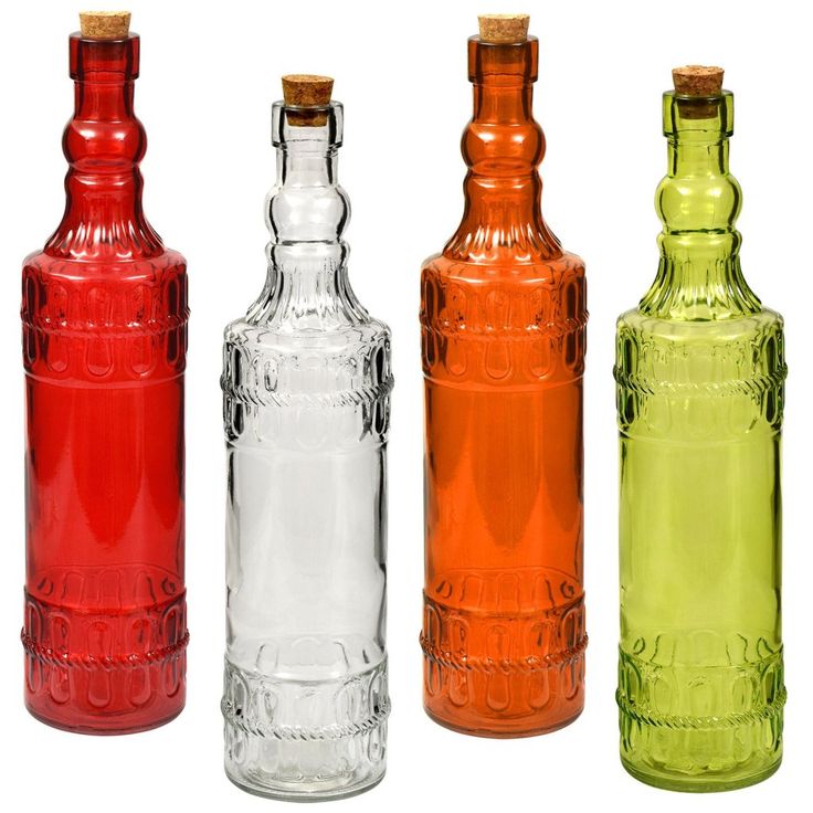 four different colored glass bottles lined up in a row