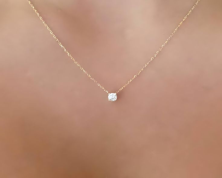 Elevate your jewelry collection with our exquisite 14k 0r 18k Gold Diamond Solitaire Necklace. This stunning piece features a natural, earth-mined round brilliant cut diamond, set in a delicate yet sturdy 14k or 18k solid gold chain. Perfect for any occasion, this necklace is a timeless addition to your wardrobe, whether you're dressing up for a special event or adding a touch of elegance to your everyday look. Key Features Diamond Quality: Natural round brilliant cut diamond, 0.15ct, SI1 clarit Minimalist Solitaire Necklace In Yellow Gold With Diamond Accents, Minimalist Everyday Diamond Solitaire Necklace, Delicate Gold Diamond Solitaire Necklace, Minimalist Yellow Gold Diamond Solitaire Necklace, Refined Yellow Gold Solitaire Diamond Necklace, Moms Day, Solitaire Necklace, Simple Diamonds, Diamond Solitaire Necklace