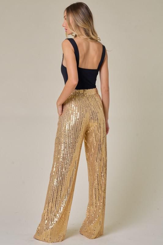 Our Liv Sequin Pants are a must have! These gorgeous panys are perfect for the Holiday Season.Structured, wide leg pants, fully lined. Spring Party Wide-leg Dress Pants, Glamorous High-waisted Wide Leg Pants, Elegant Full-length Pants For Spring, Elegant Full-length Spring Pants, Elegant Full Length Pants For Spring, High-waisted Bottoms For Night Out With Elastic Waistband, High Waist Pants With Elastic Waistband For Night Out, Glamorous Stretch Pants For Spring, Elastic High-waisted Bottoms For Night Out