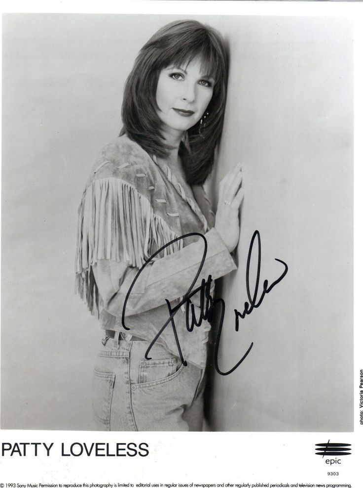 patty loveless autographed in black and white photograph with fringed jacket on