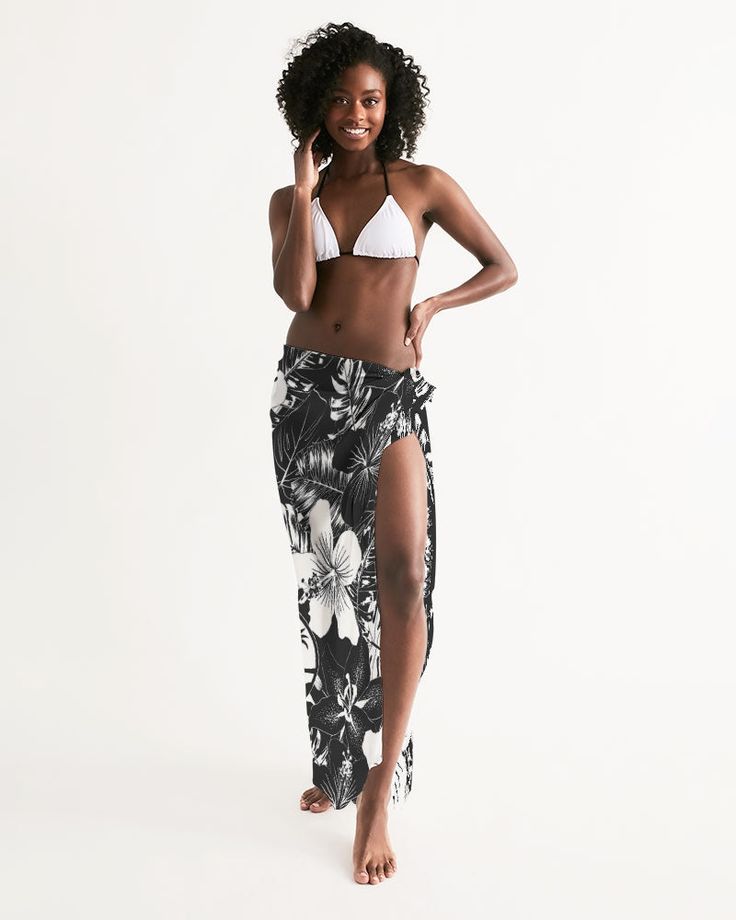 Our Guam Women's Swim Cover Up is a must-have, whether you're heading to the beach or pool. With a lightweight and flowy feel, this accessory can be styled in multiple ways to complete your swimwear look. Lightweight, sheer, flowy fabric Self-tie closure Printed, cut, and handmade Size & Fit One size fits all Style multiple ways Length: 55"x 54" Model is 5'9, one size Material & Care Machine wash cold, tumble dry low 100 % Polyester Fabric weight: 5.60 oz/yd² (190g/m²) Imported Shipping Every sarong is handmade just for you 5-7 business days before it's shipped out. $3.99 Standard Shipping: 7-10 business days for continental US, longer for rest of the world. Beachy Tropical Print Cover-up For Beach, Black Beachwear Swimwear For Vacation, Beachy Adjustable Swimwear For Vacation, Black Beachwear For Vacation, Adjustable Beachy Swimwear For Vacation, Adjustable Swimwear For Beach Party Vacation, Adjustable Swimwear For Poolside And Beach Season, Adjustable Swimwear For Poolside And Beach, Adjustable Beachy Swimwear For Poolside