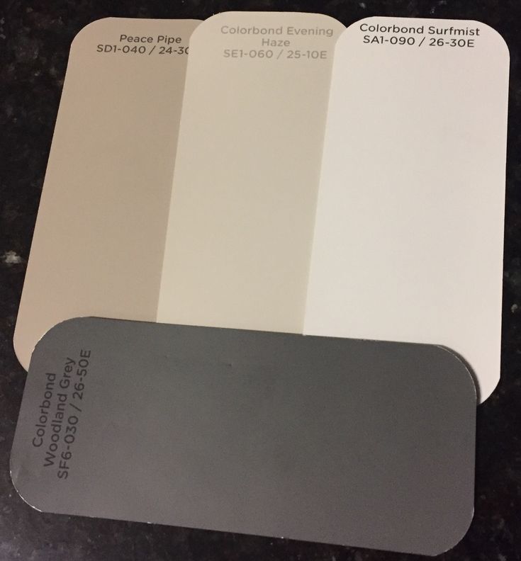 some white and gray paint samples on a table