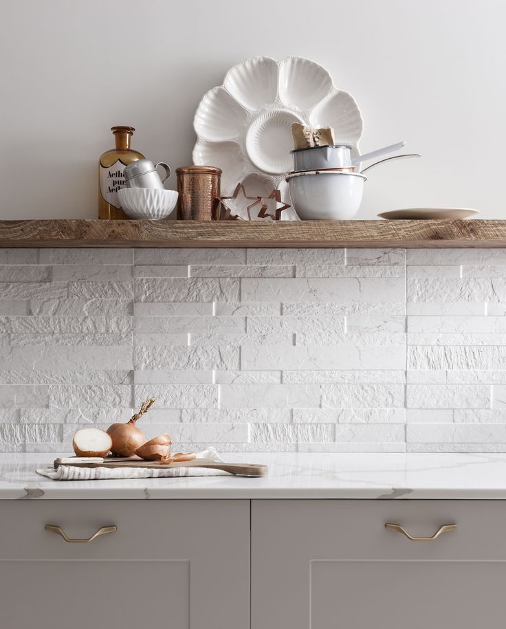 the kitchen counter is clean and ready to be used for cooking, with dishes on it