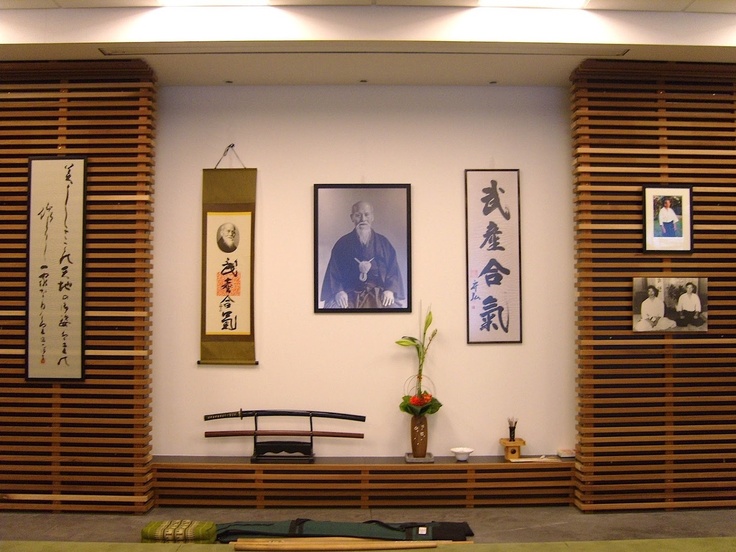 a room with wooden slats and pictures on the wall