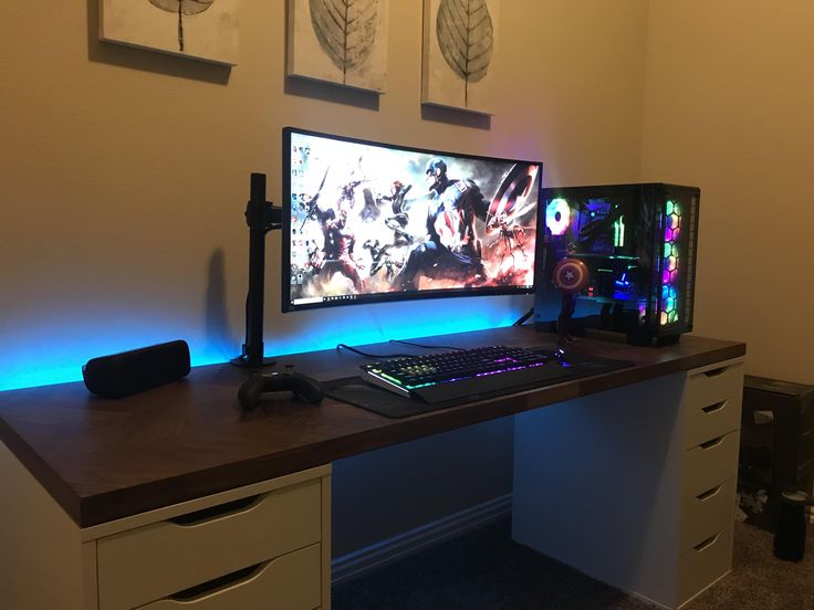 a computer desk with two monitors on it