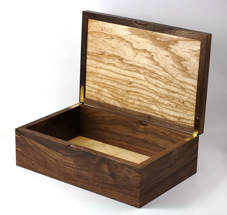 an open wooden box on a white background