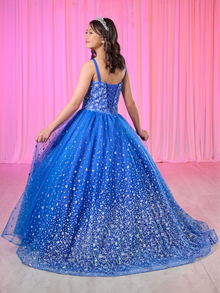 Your sweet girl will look like a fairy-tale Princess in this glitter long sleeveless V-neck dress with an A-line skirt by Tiffany Princess 13767. V-neckline with spaghetti straps, fully glitter bodice with layers of tulle ball gown skirt. Lace-up back and sweep train. This princess gown matches with 56522. Girls Glitter V-Neck Gown by Tiffany Princess 13767 House of Wu Tiffany Princess Collection Fall 2024 Style Number: 13767 Fabric: Glitter Dots Tulle Please note: There may be a loss of glitter Pageant Dress For Prom Season With Corset Back, Prom Season Pageant Dress With Corset Back, Glamorous Pageant Dress With Corset Back, Pageant Tulle Dress With Corset Back, Pageant Ball Gown Dress With Corset Back, Pageant Dress With Corset Back And Tulle, Tulle Dress With Corset Back For Pageant, Princess Gown With Fitted Bodice And Glitter Tulle, Fairytale Ball Gown For Party With Fitted Bodice