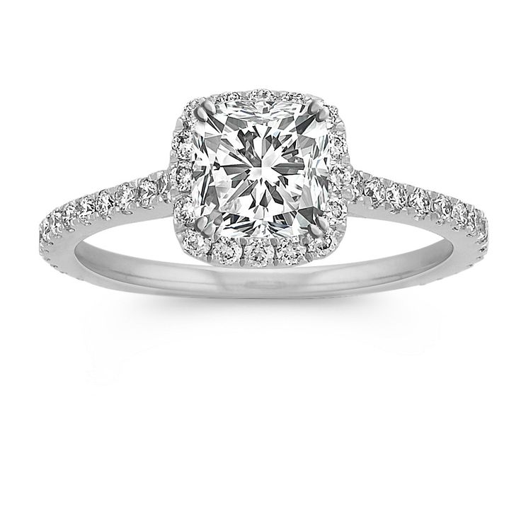 a cushion cut diamond ring with pave set shoulders