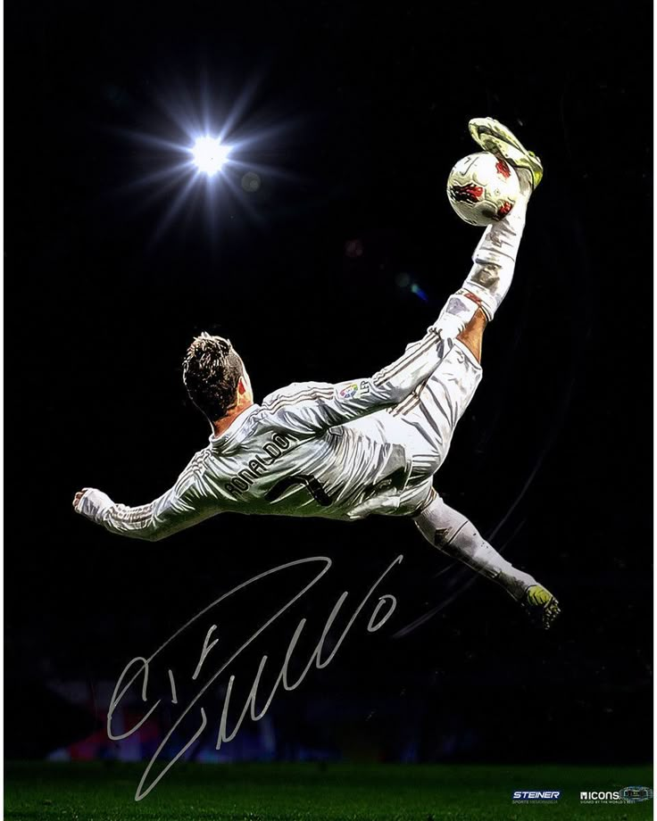 a soccer player is jumping in the air to catch a ball