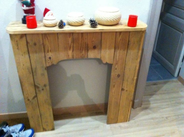 a wooden table with two bowls on it and some cups sitting on top of it