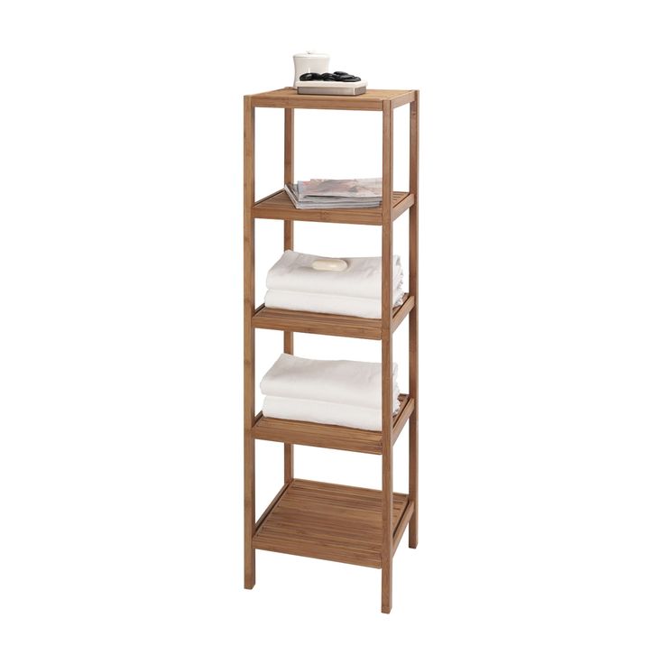 a wooden shelf with towels on it