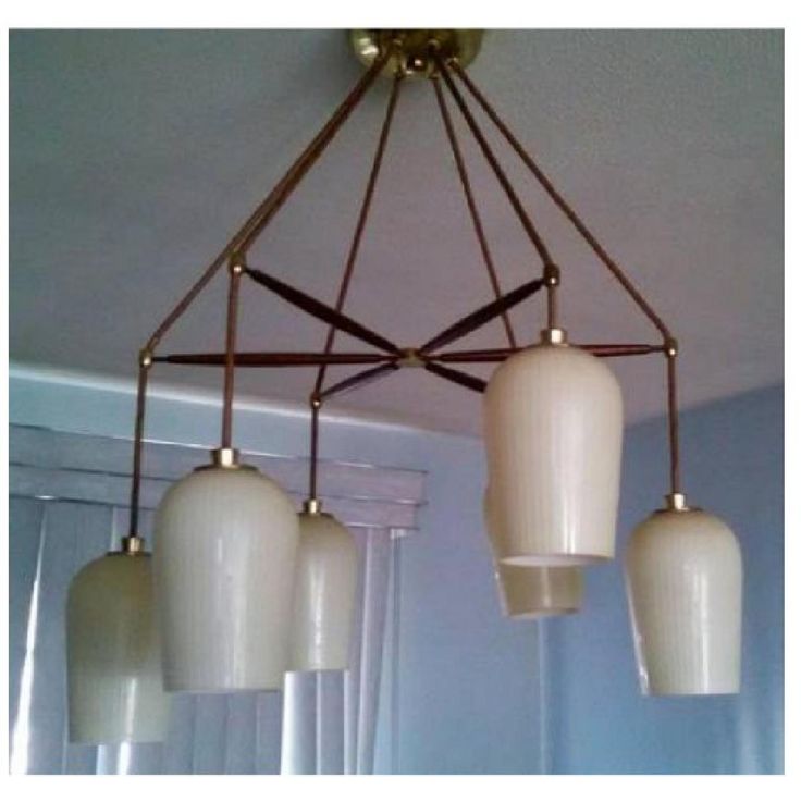 a chandelier with five lights hanging from it