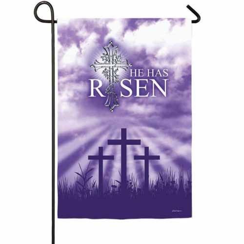 the has risen banner with cross in front of clouds and sunbeams on purple background