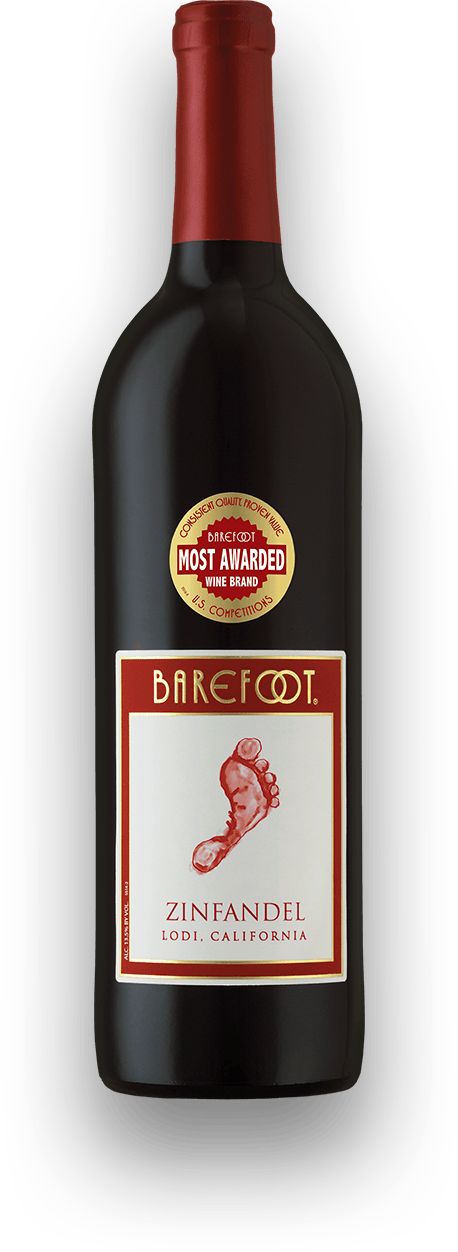 a bottle of wine with a red cap on it's top and label in the bottom