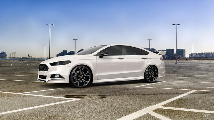 a white car is parked in an empty parking lot next to some lights and poles