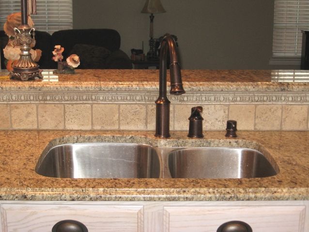 the kitchen sink is clean and ready for us to use in its new owner's home