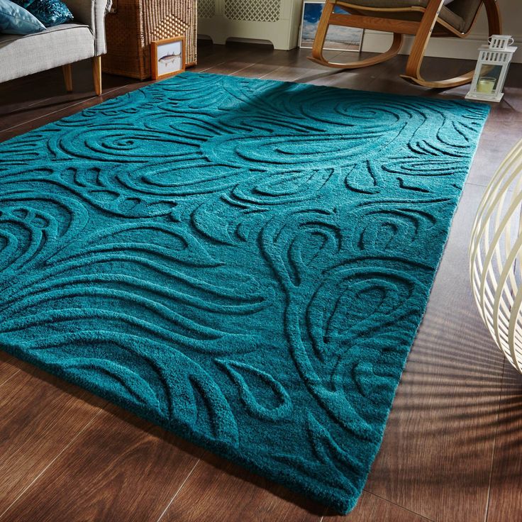 a blue area rug in a living room