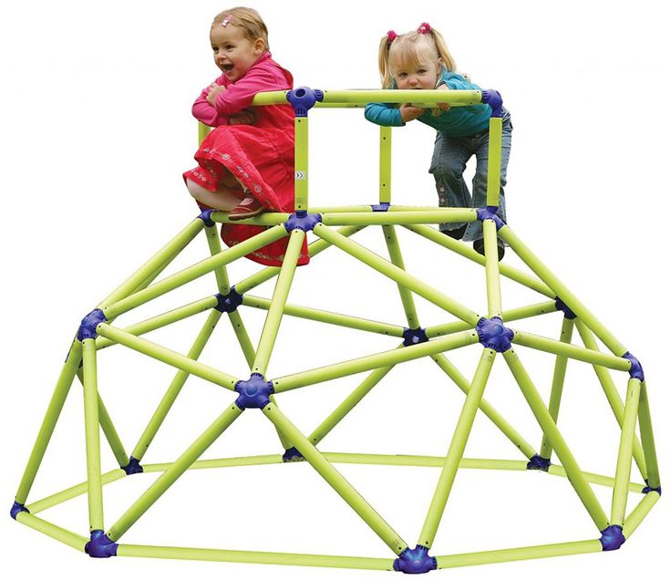 two small children playing on a play structure