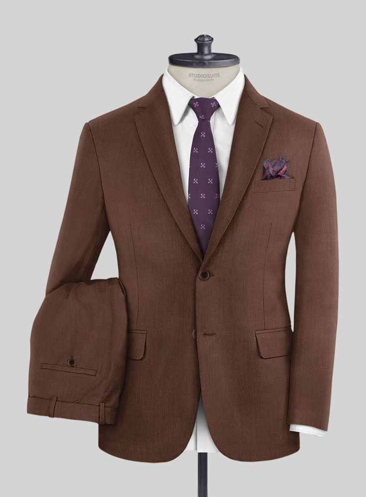 Everytime a brown suit was put to a test, it passed with flying colors. Crafted from 100% wool, our Scabal Brick Brown Wool suit is a wardrobe essential for timeless styling, which has been gently milled to give a soft superior feel. Wear this sleek suit to special occasions, whether you're headed to work or looking to add some class to your everyday outfits for years to come. Simply pair it up with a matching waistcoat, white shirt, maroon tie and black shoes to seal the ensemble.   Look Includes  Scabal Brick Brown Wool Fabric  Two Button Jacket Style  Notch Lapel  Real Horn Brown Buttons  Single Vent  Three Cuff Buttons  Two Welted Back Pockets on Trousers    You can change the look during customization if required.   Weight: Light Weight/260gr, Lining: 100% Viscose, Dry Clean. Tailored Brown Three-piece Formal Suit, Tailored Brown Three-piece Suit For Formal Occasions, Brown Tailored Three-piece Suit For Formal Occasions, Elegant Brown Blazer For Semi-formal Occasions, Brown Fitted Three-piece Suit For Semi-formal Occasions, Brown Double Breasted Suit With Notch Lapel, Brown Double Breasted Suit With Welt Pockets For Work, Semi-formal Brown Double Breasted Suit With Welt Pockets, Brown Double Breasted Suit For Business In Fall