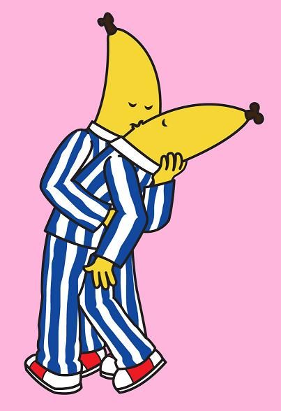 a cartoon character with a banana on his head and striped pajamas, holding it up to its face