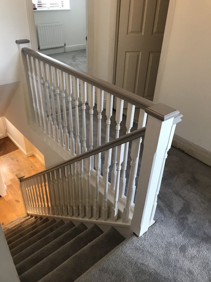 an empty room with stairs leading up to the door