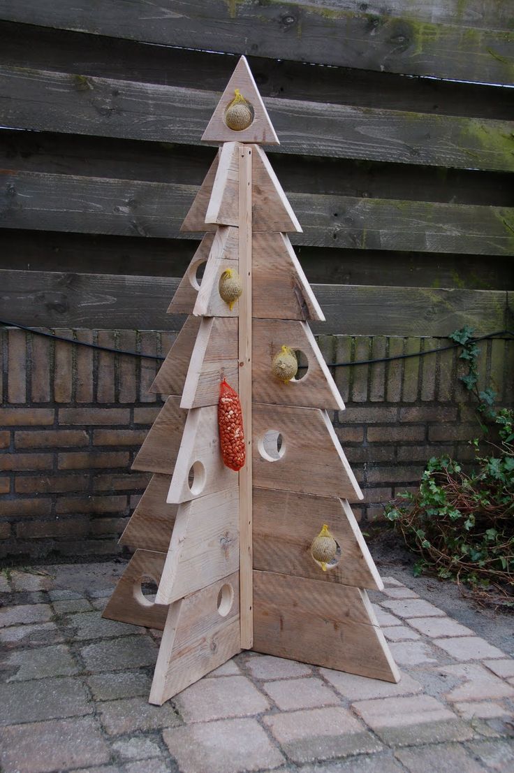 a christmas tree made out of wooden boards