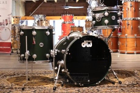 a black drum set sitting on top of a rug