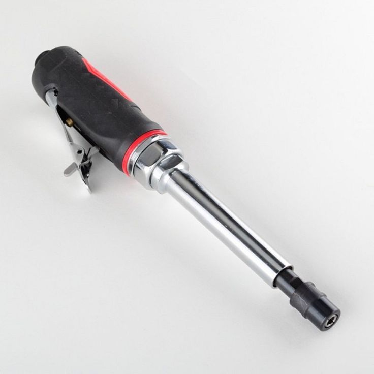 a black and red electric drill on a white background with clippings to the side