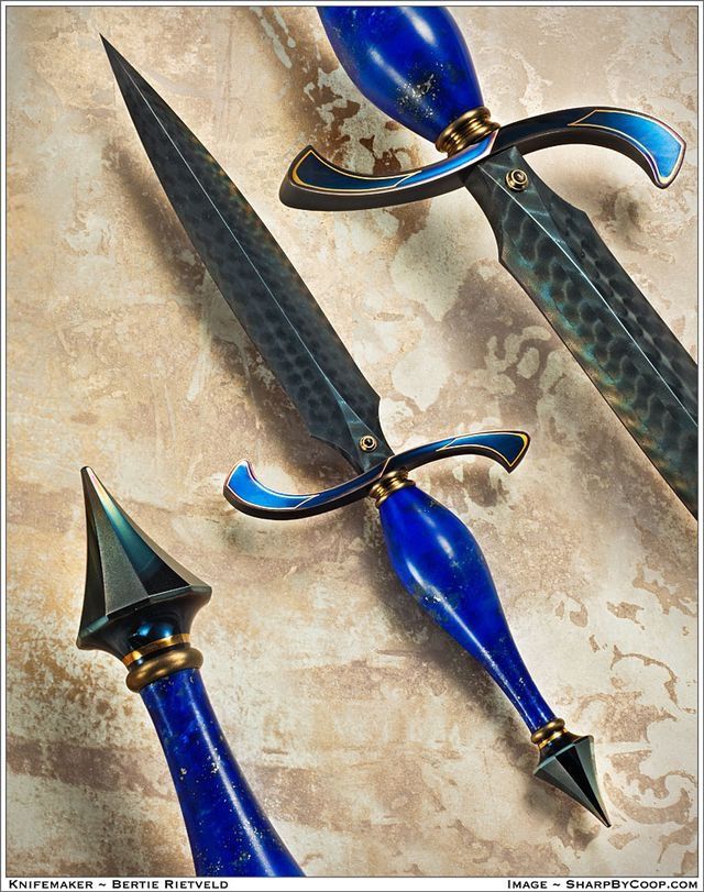 three blue swords with black handles and gold accents