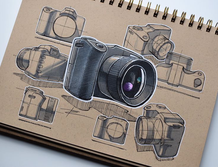 a drawing of a camera on top of a notebook