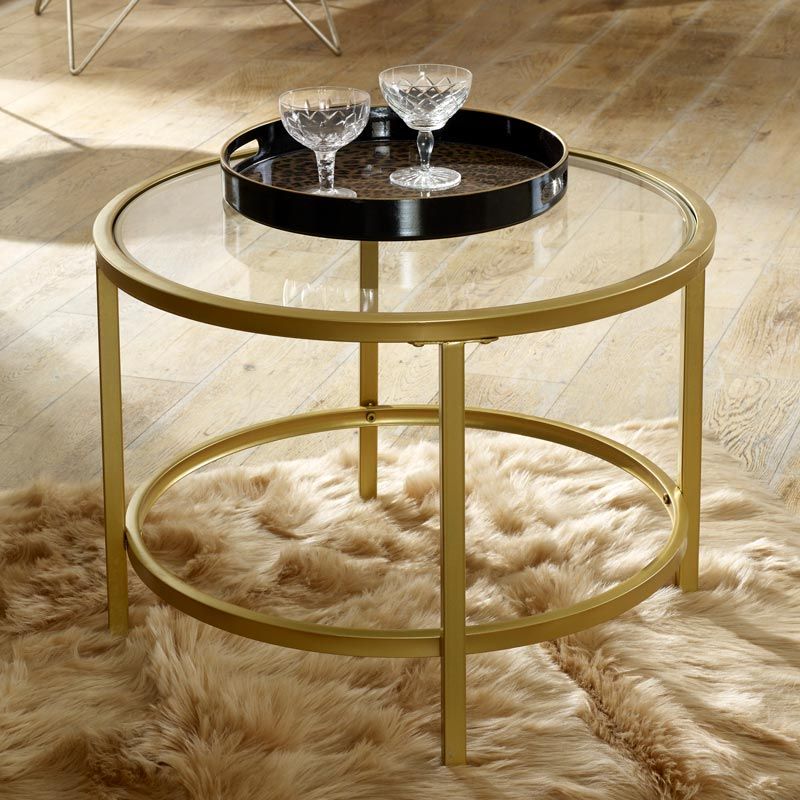 This Vintage Gold Round Glass Top Coffee Table is a stunning furniture storage piece for a