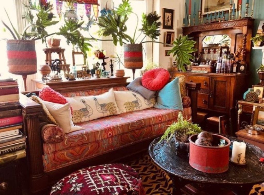 a bright maximalist living room with heavy vintage furniture, colorful ...