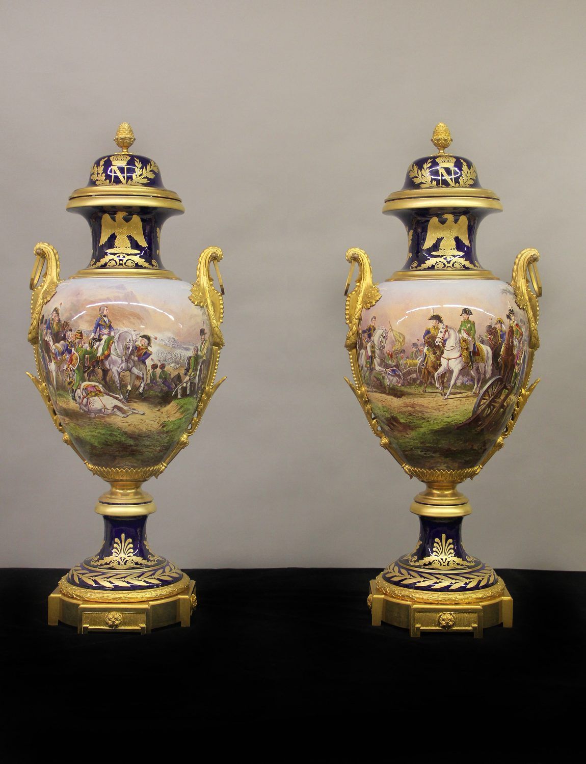 Each vase of ovoid form with “wrap-around” painted battle scenes of ...