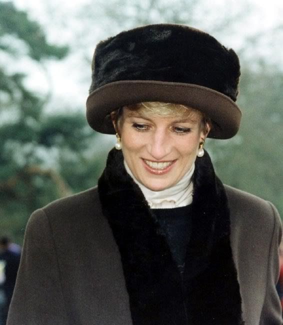 Diana bundled up on Christmas Day 1994 in a long chocolate coat and ...