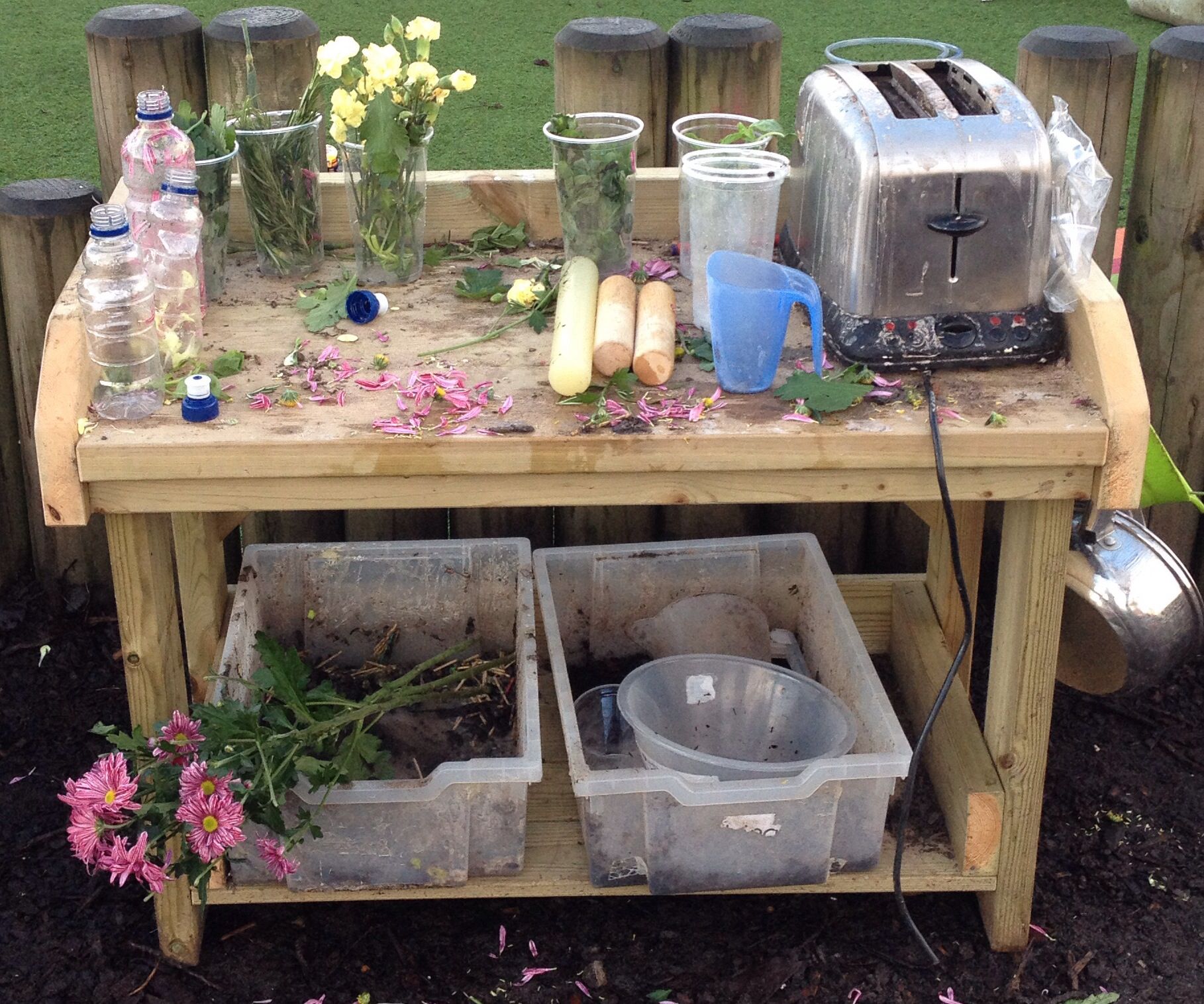 Perfume potion making in the mud kitchen  Child Care 