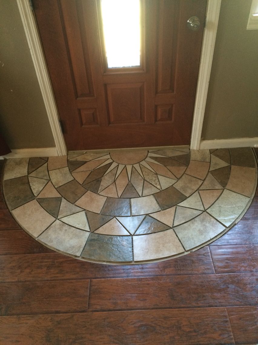 Tile doorway entry. Protecting the laminate from tracking the elements