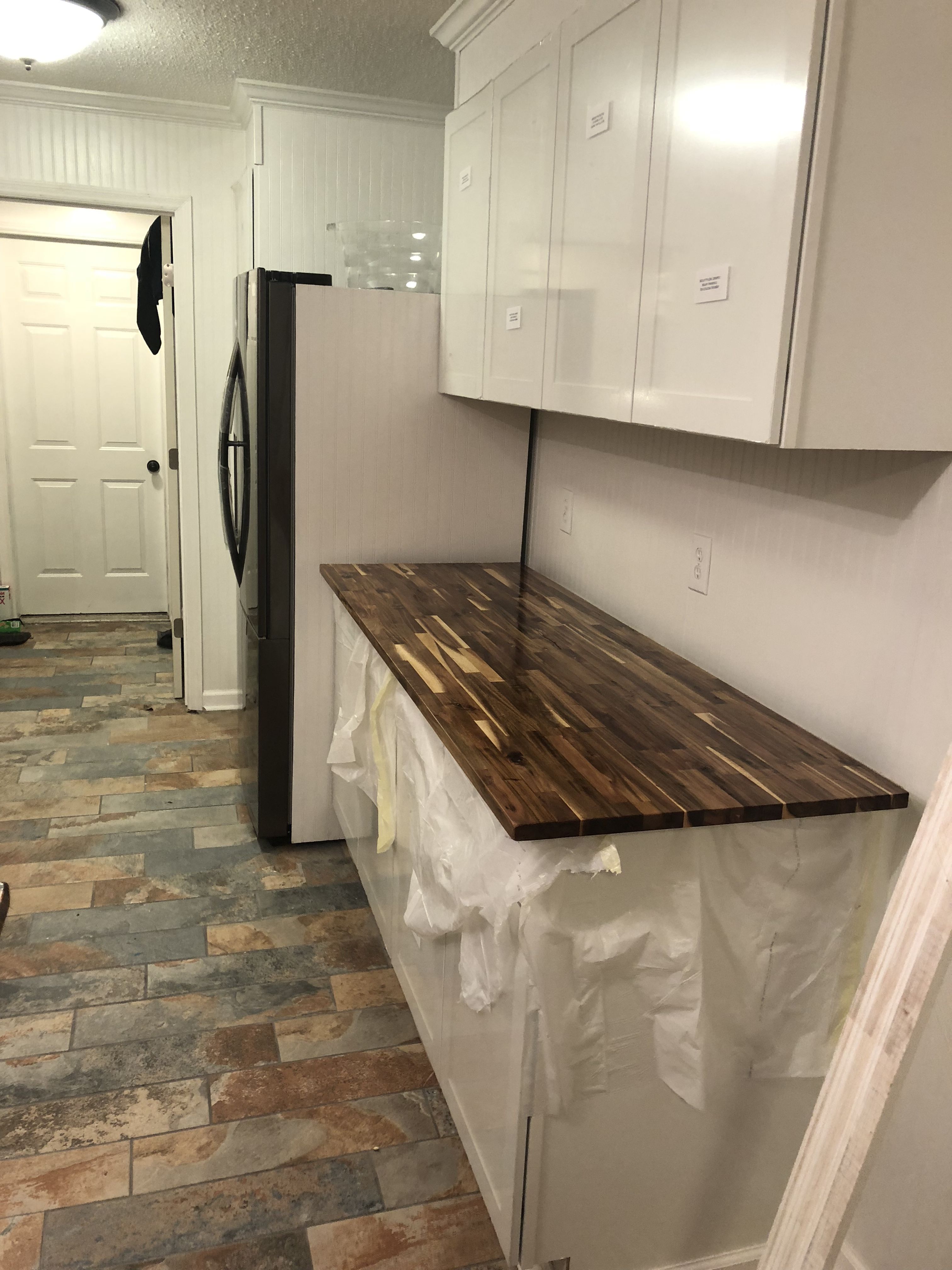 Almost completed Acacia butcher block with beadboard backsplash and