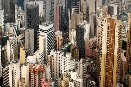 an aerial view of many tall buildings and skyscrapers in a city with ...