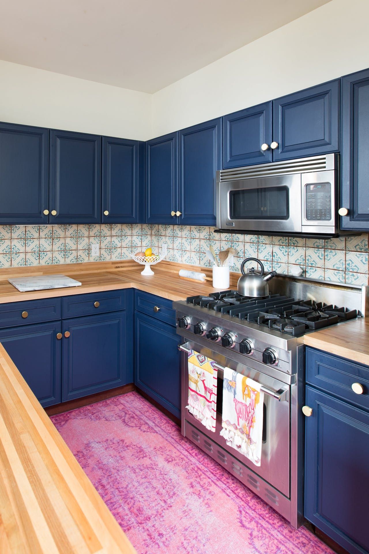 A “California Cool” Condo in a Former Elementary School Blue kitchen