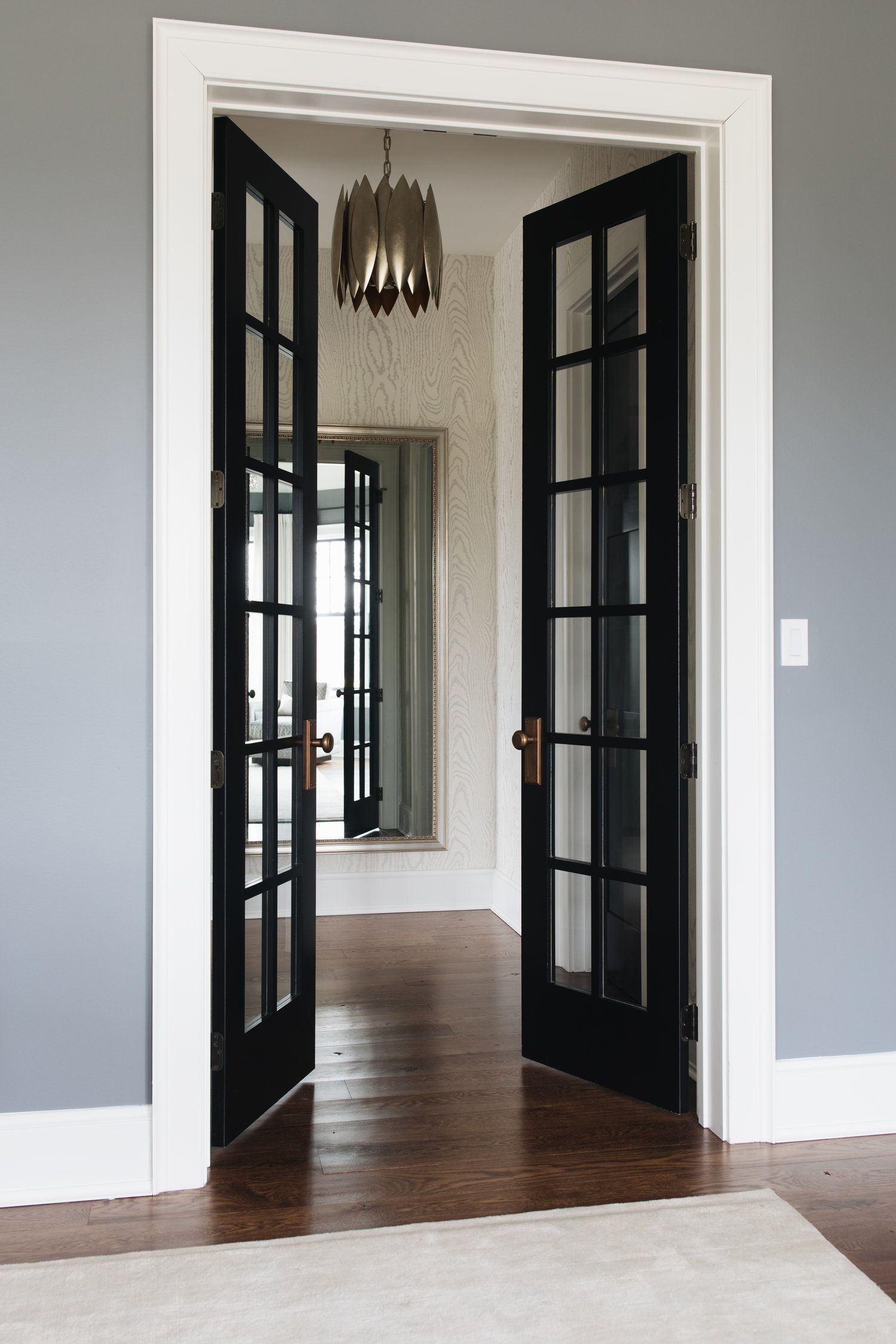 JSD Jean Stoffer Design Black french doors and white skirting board