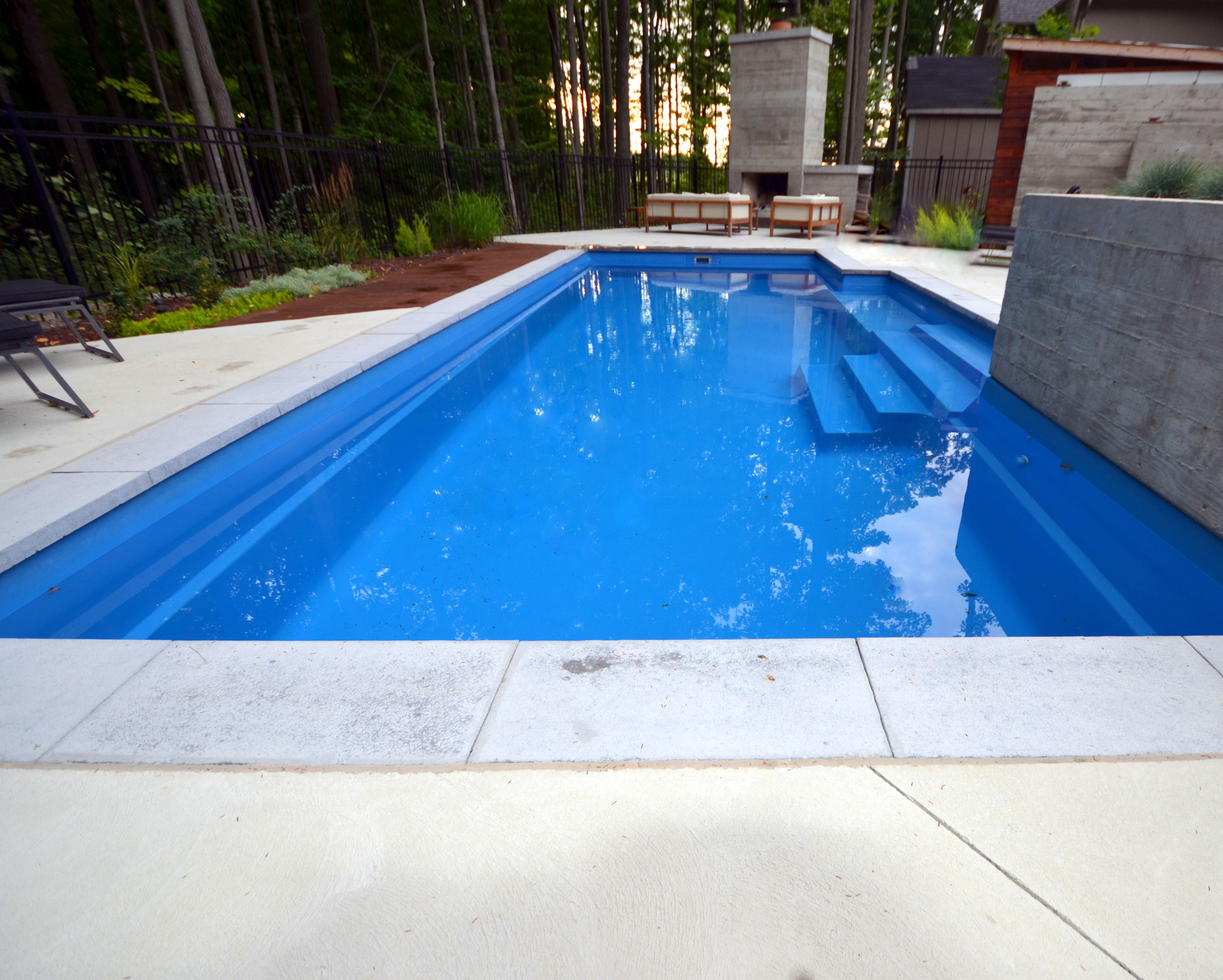 natural stone coping on a fiberglass pool with concrete patio Pool ...