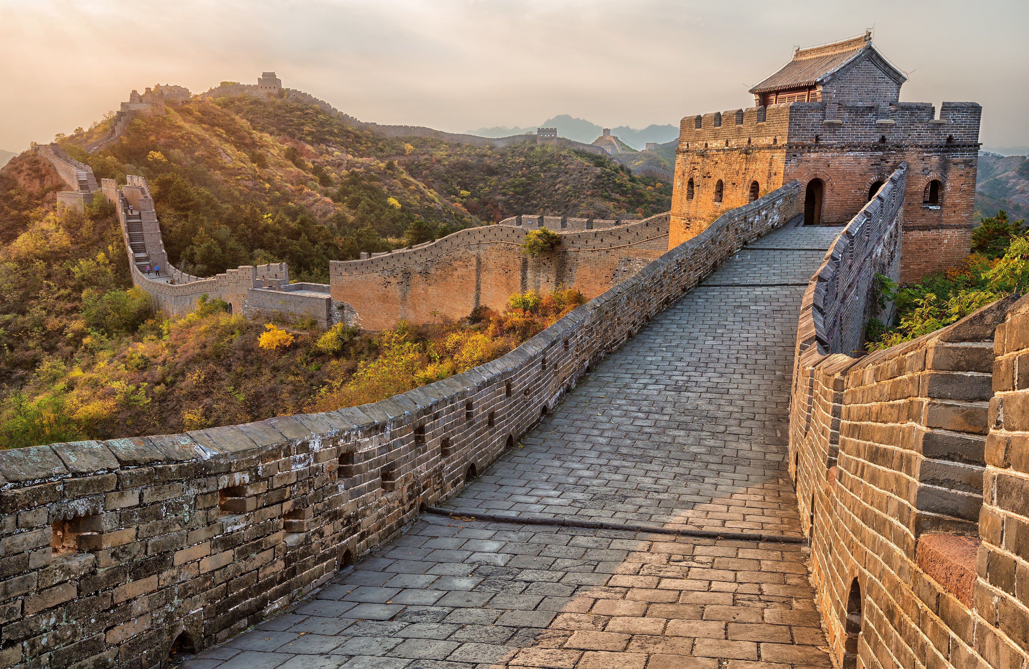 the great wall of china is built on top of an old stone structure with ...