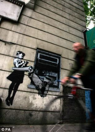 New Banksy art work showing government agents spying on a phone box