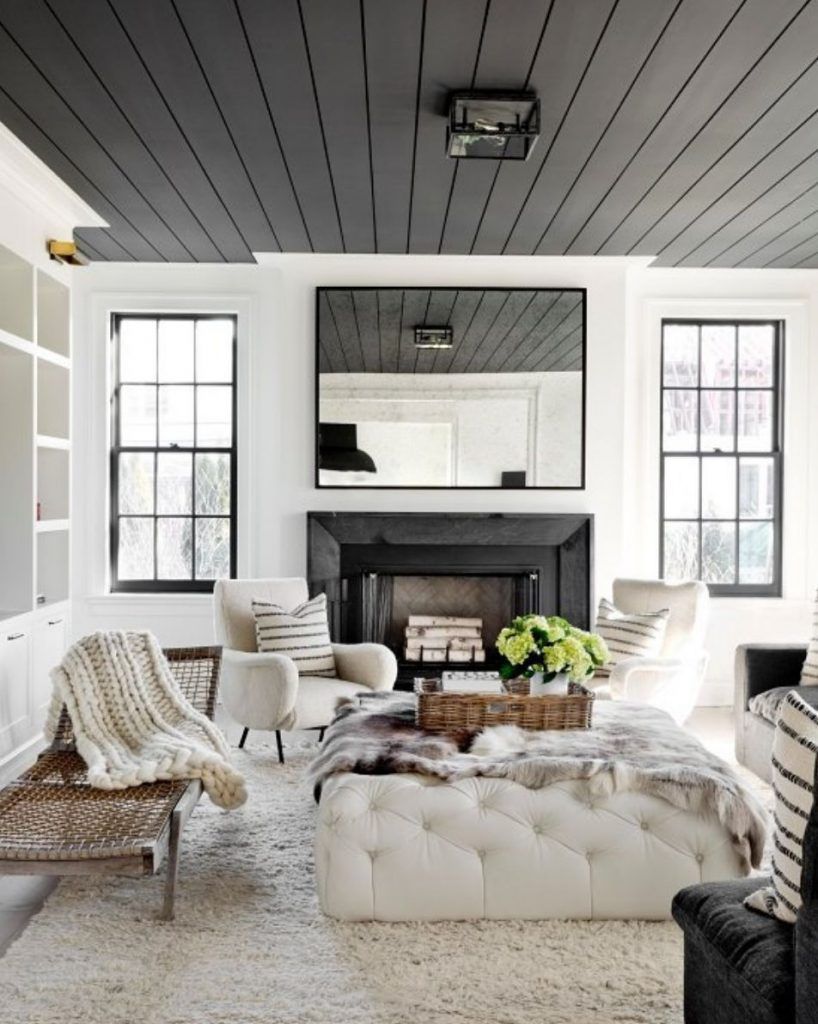 A dark gray ceiling contrasts beautifully against stark white walls