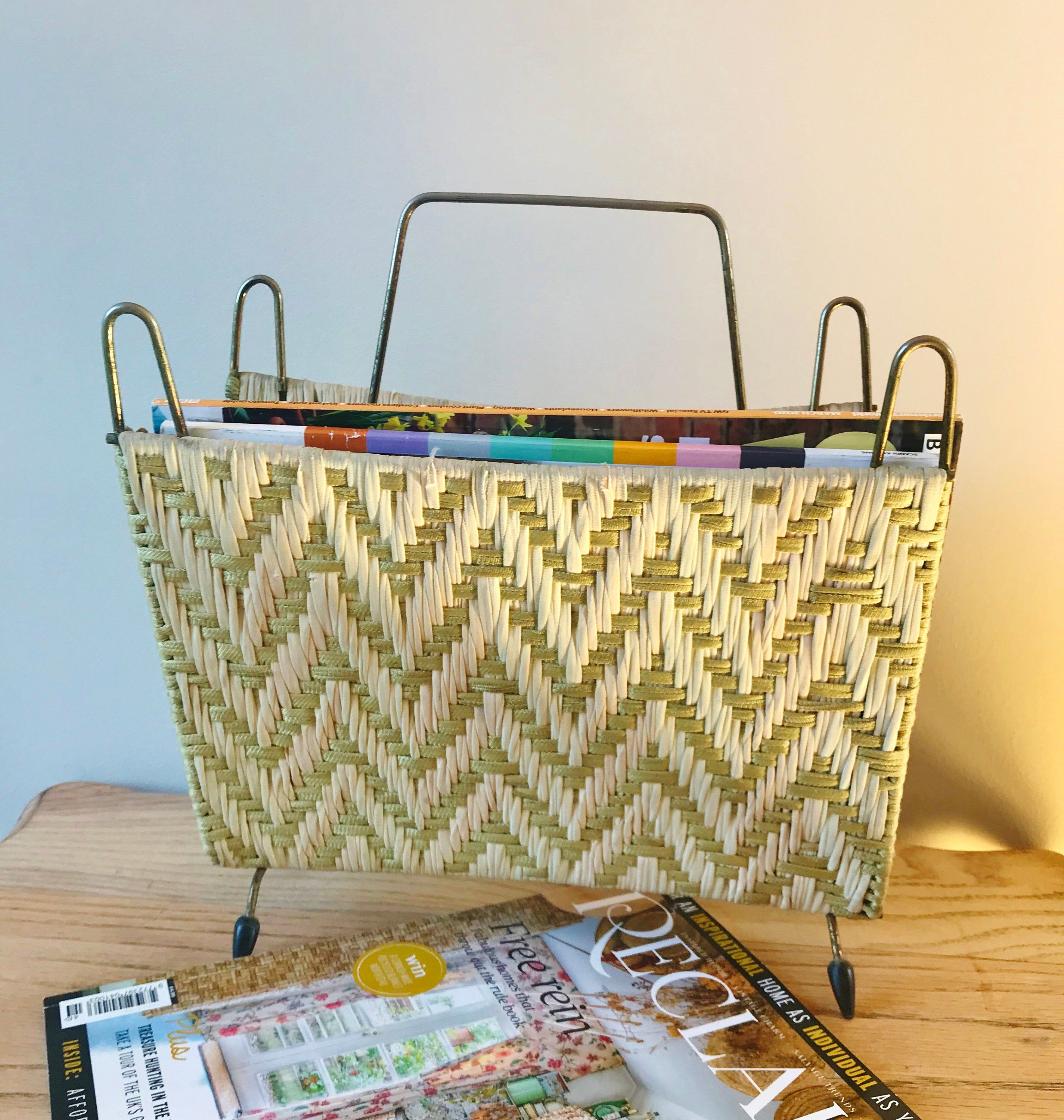 a magazine rack sitting on top of a wooden table