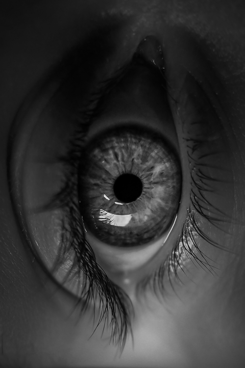 an extreme close up view of the iris of a person's eye