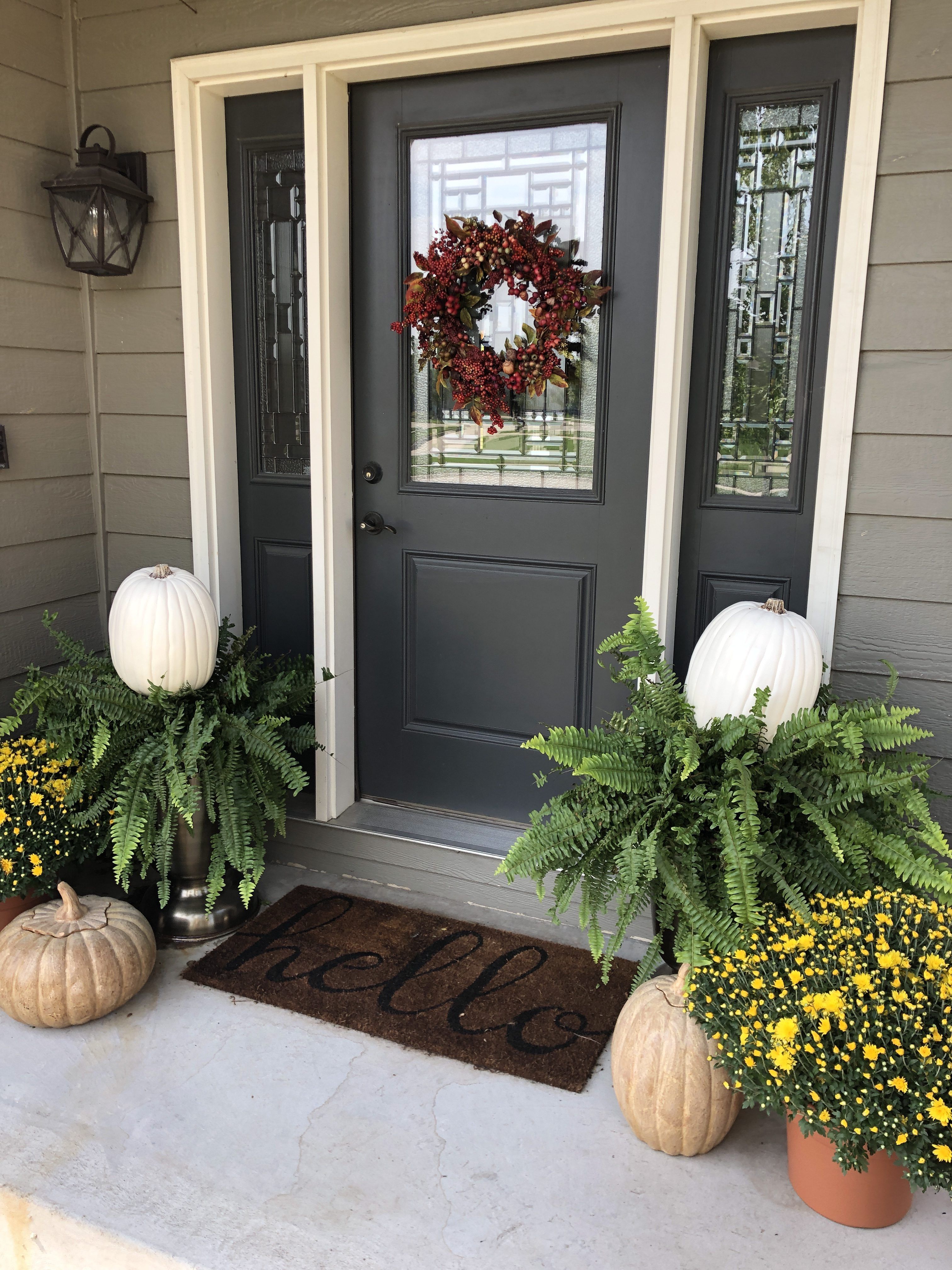 Simple fall front porch decor using ferns, mums and pottery pumpkins ...