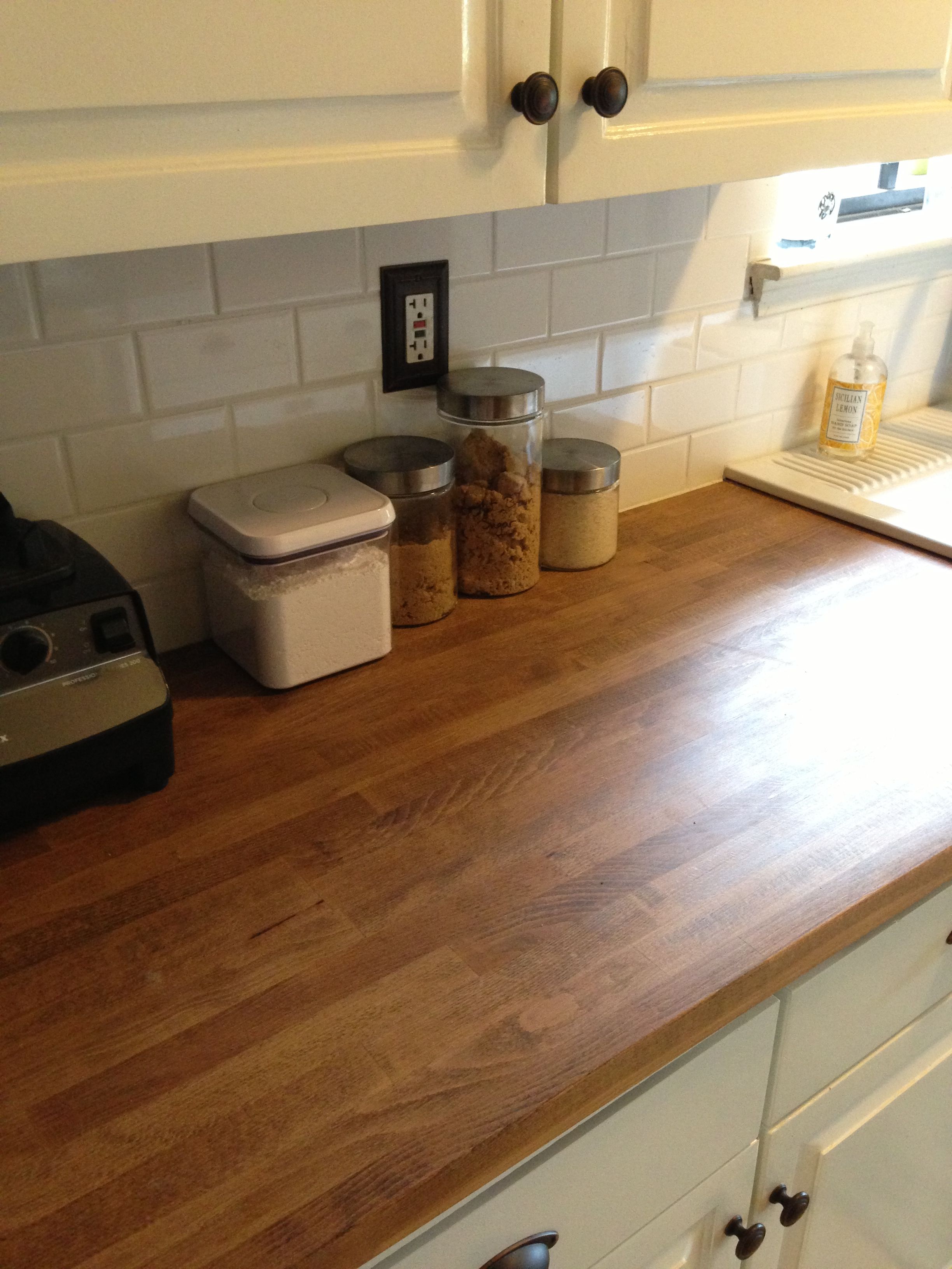 Butcher block countertops. LOVE with the white Butcher block