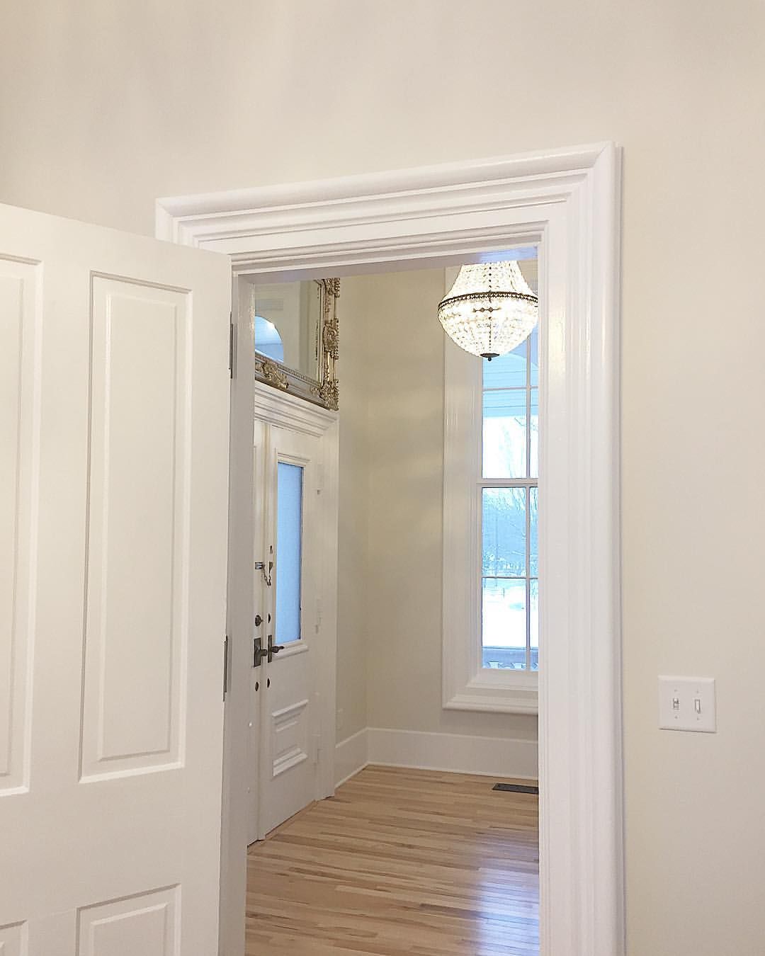 Large old trim and casing painted Sherwin Williams Extra White with