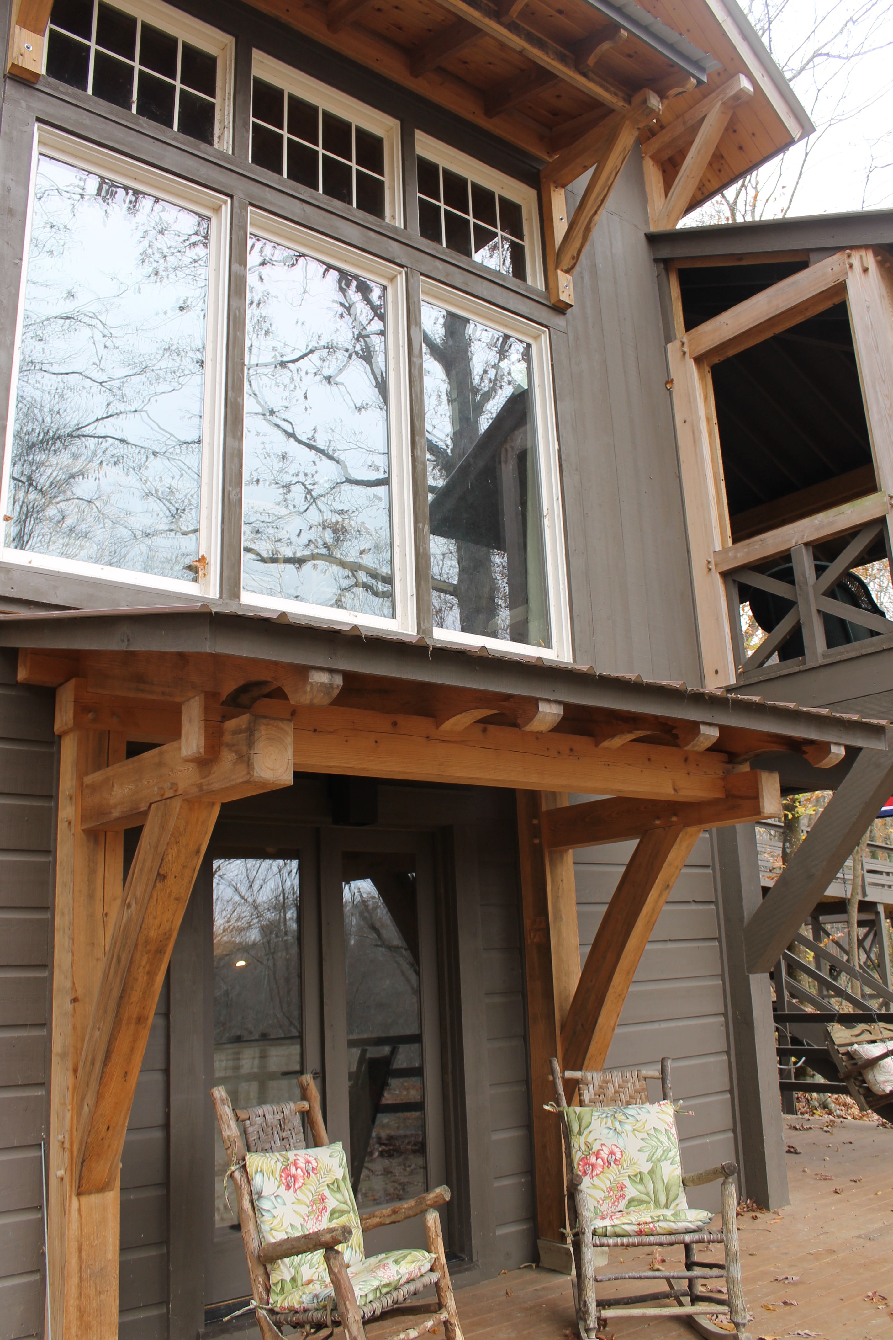 Basement entry trimmed in handcut heavy timbers | Timber frame porch ...